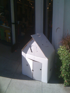 small, white cardboard house